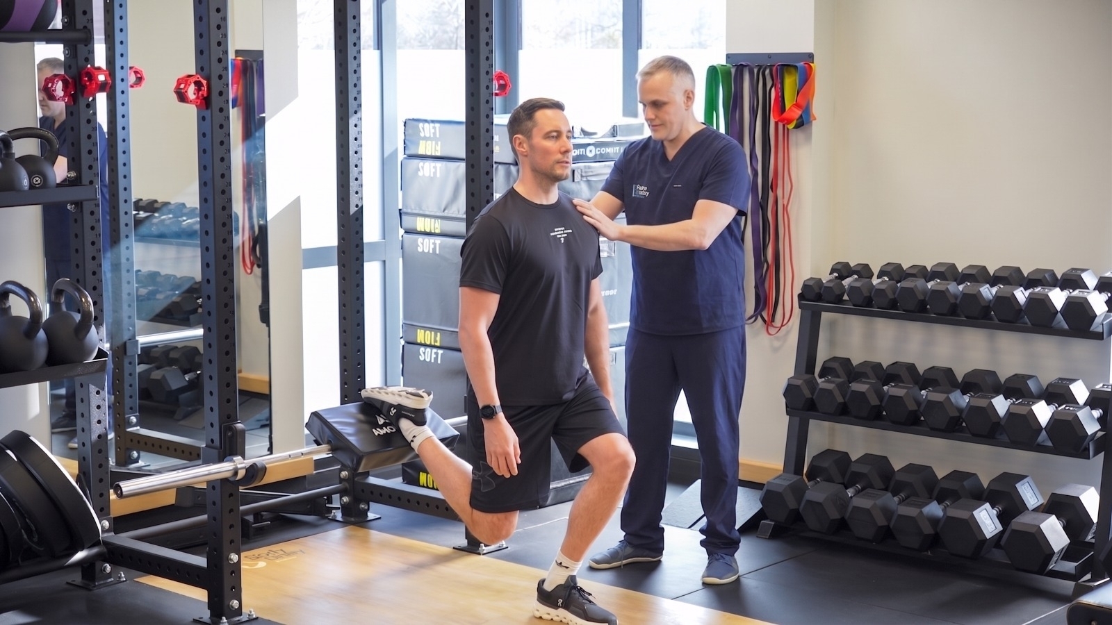 Body Unity practitioner guiding a patient through movement rehabilitation